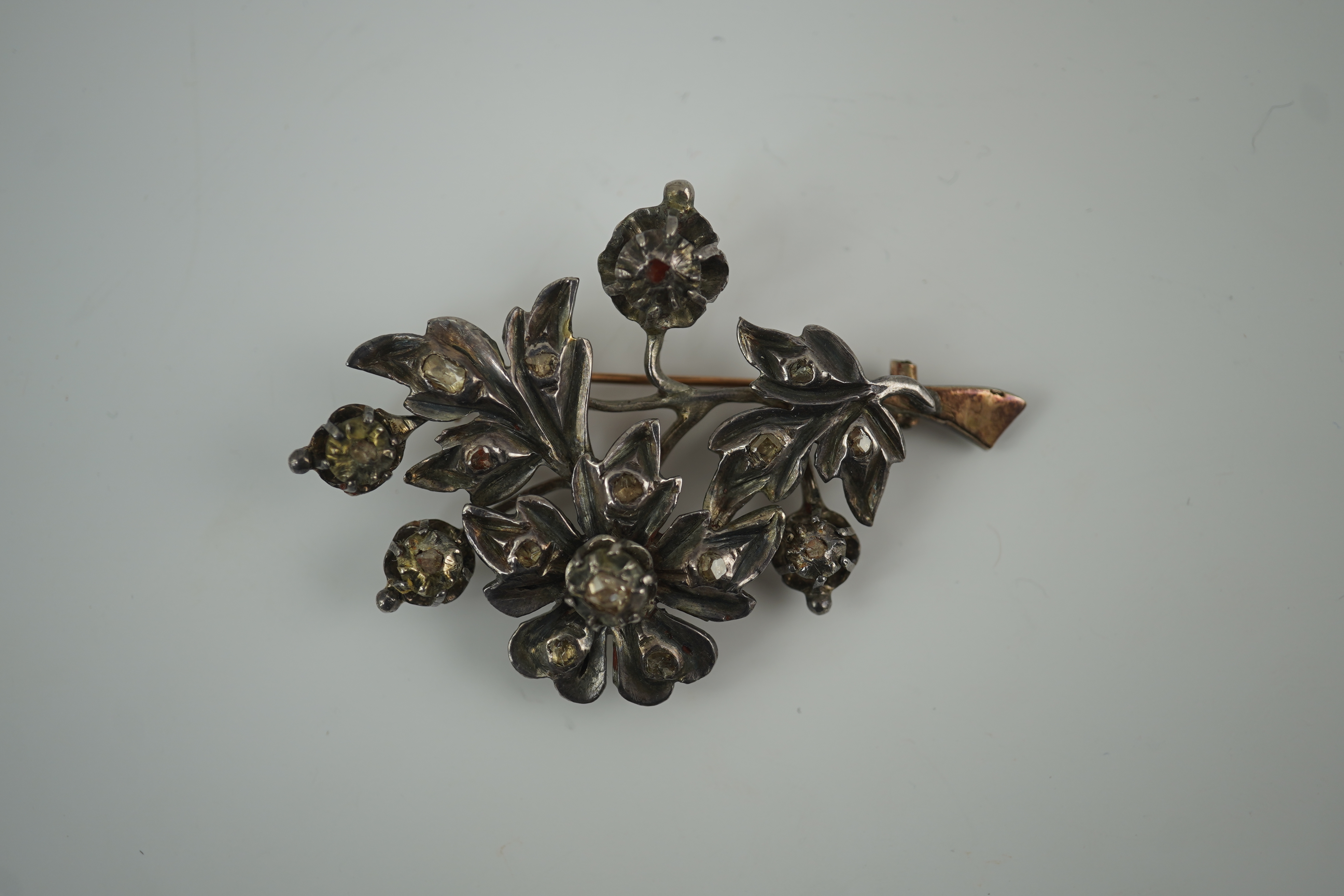 A Victorian gold overlaid silver and rose cut diamond set floral spray brooch